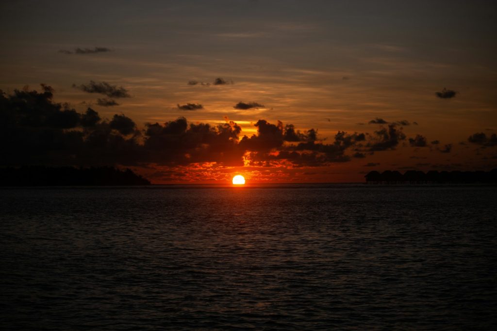 a sunset over a body of water